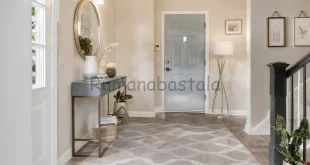 Area pintu masuk minimalis dengan dekorasi elegan, menciptakan kesan rumah welcoming dan stylish sejak awal.